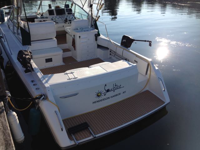 Custom teak AquaMats really make this boat look great! These look like real teak but are actually snap in carpets!